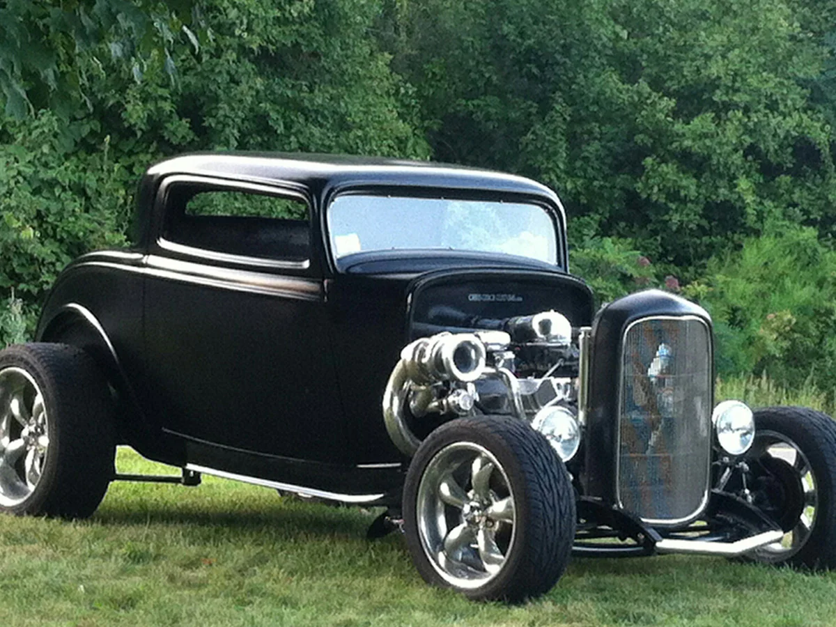 Black 1932 Ford Coupe with exposed twin-turbo engine