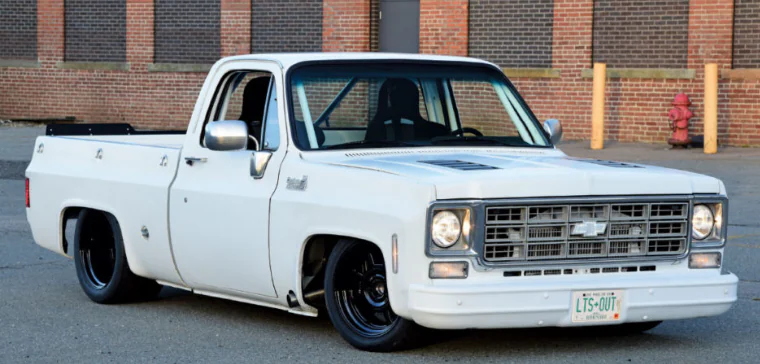 White 1978 Chevrolet C10 pickup photographed outside a brick building