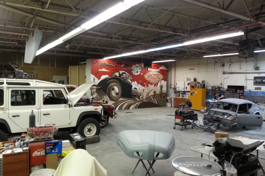 Archival view of a Land Rover project inside an earlier Chris Cerce Customs workshop