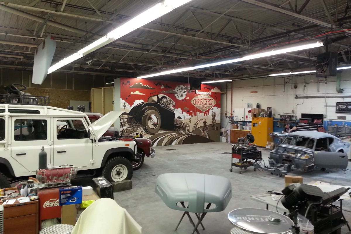 Archival view of a Land Rover project inside an earlier Chris Cerce Customs workshop