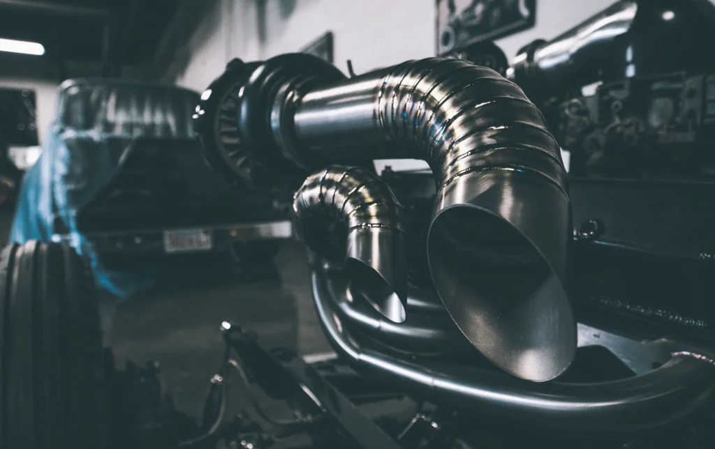 Close view of formed metal tubing and engine components