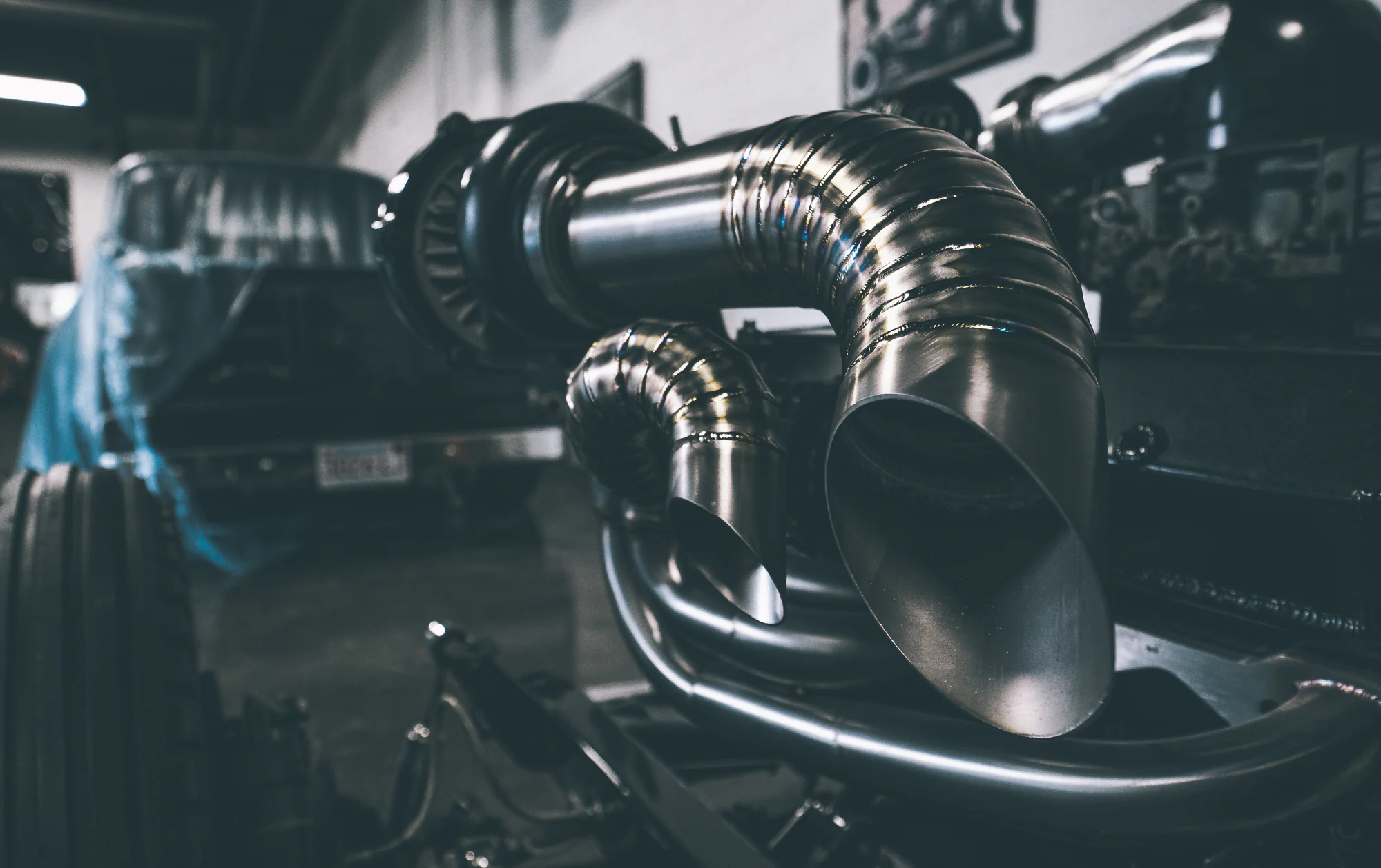 Close view of formed metal tubing and engine components